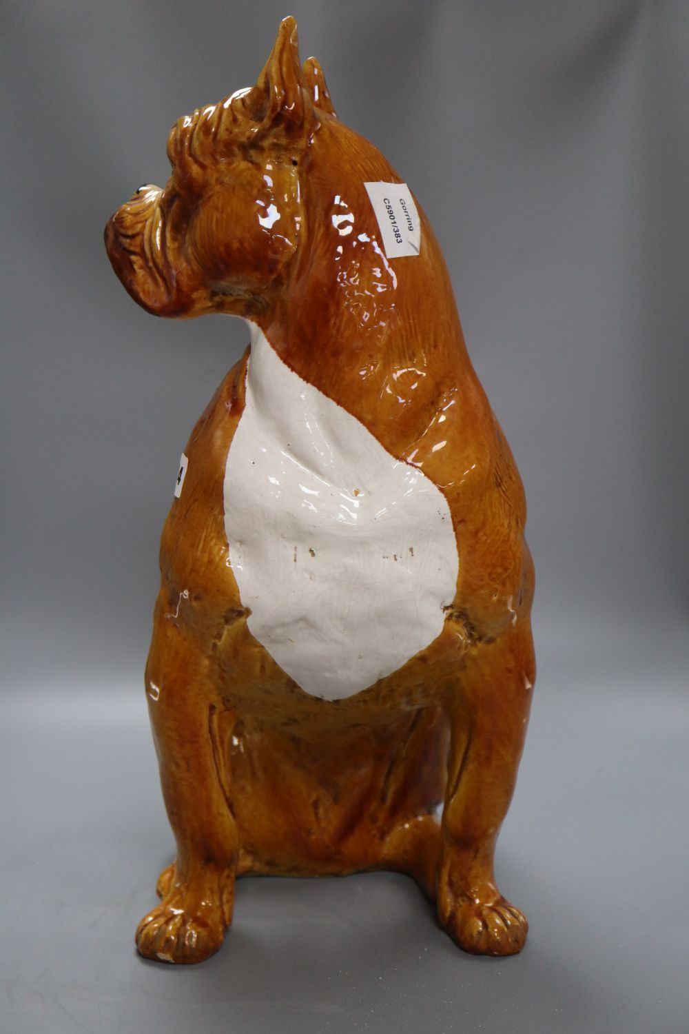 A large tinglaze pottery figure of a boxer dog, height 50cm